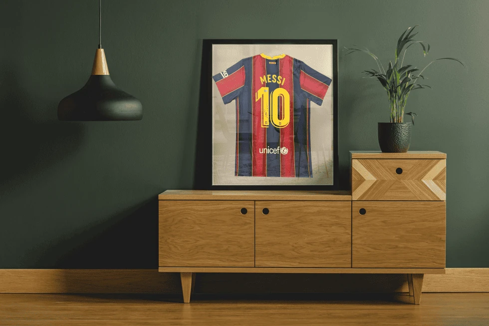 Framed-Jersey-980x653 Custom framed Messi jersey displayed in a home.